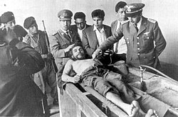 The day after his execution on 10 October 1967, Guevara's corpse was displayed to the news media in the laundry house of the Vallegrande hospital (photo by Freddy Alborta [es]). Face Side angle Shoes