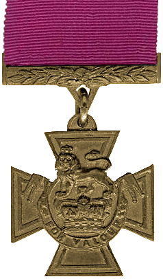 A medal in the shape of a cross hanging from a crimson red ribbon.