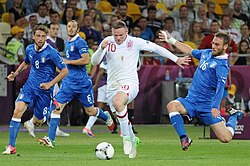 Rooney taking on the Italian defence at UEFA Euro 2012