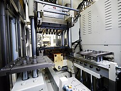 Compression molding machine for rubber parts