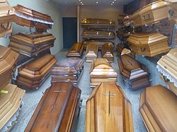 A display of coffins in the office of a funeral director in Poland