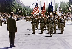 Schwarzkopf is met by President George H. W. Bush during a homecoming parade for troops returning from the Gulf War in 1991