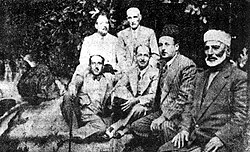 Quwatli (first from the bottom left) seated with members of the Syrian nationalist movement, 1920s. Seated next to Quwatli are Said al-Ghazzi, Riad al-Shurbaji, Sheikh Saleh al-Ali. Standing left to right are Hajj Adib Kheir and Ibrahim Hananu