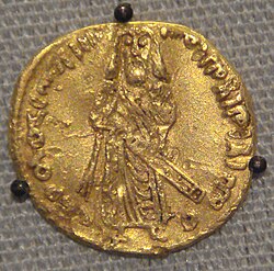 Abd al-Malik introduced an independent Islamic currency, the gold dinar, in 693, which originally depicted a human figure, likely the caliph, as shown in this coin minted in 695. In 697, the figural depictions were replaced solely by Qur'anic and other Islamic inscriptions