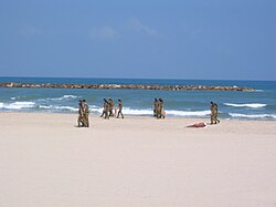 IDF soldiers cleaning the beaches at Tel Aviv, which have scored highly in environmental tests[119]