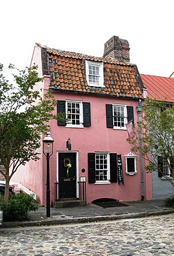 The Pink House, at 17 Chalmers Street, was built of Bermudian limestone between 1694 and 1712 and is the oldest stone building in Charleston.