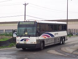 MCI D4000 hybrid leaving Ironbound Garage