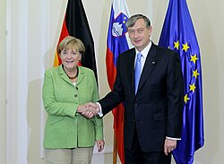 Türk with German Chancellor Angela Merkel, 30 August 2011