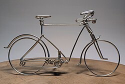 Bicycle made from a single long metal wire.
