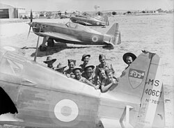 Australian troops posed with captured Vichy French fighters at Aleppo-Nayrab airfield during the Syrian campaign, July 1941