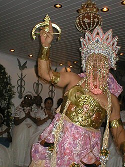 A practitioner dressed as the orixá Obá in Brazil; the possession of adherents by orixás is central to Candomblé