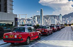 Toyota Crown Comfort taxicabs lined up in front of Kowloon Waterfront in Hong Kong