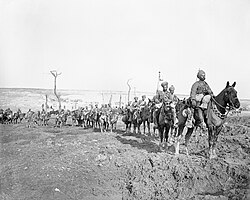 Troops of the 29th Lancers Regiment (Deccan Horse) near Pys, armed with lances and making their way through a shell torn landscape, following the German withdrawal to the Hindenburg Line, March 1917.