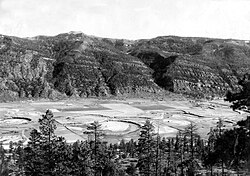 This aggradational floodplain of a small meandering stream in La Plata County, Colorado, is underlain by silt deposited above a dam formed by a terminal moraine left by the Wisconsin Glacier.