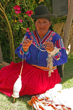 Aymara woman spinning Alpaca wool