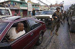U.S. Marines patrol the streets of Port-au-Prince in March 2004.