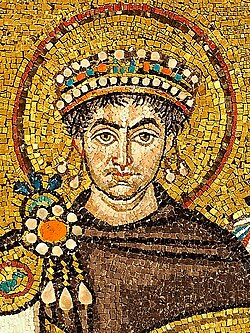 Emperor Justinian with clergy, officials, and soldiers in the apse mosaic of San Vitale, Ravenna.