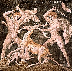 The emblema of the Stag Hunt Mosaic, c. 300 BC, from Pella; the figure on the right is possibly Alexander the Great due to the date of the mosaic, along with the depicted upsweep of his centrally-parted hair (anastole); the figure on the left wielding a double-edged axe (associated with Hephaistos) is perhaps Hephaestion.[36]