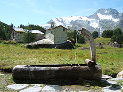 In the summers the cows are brought up to the high mountain meadows for grazing. Small summer villages such as the one shown in this photograph taken in Savoy are used.