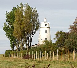 The East Lighthouse beside the Nene Outfall at Sutton Bridge, Lincolnshire, has a blue plaque recording that Scott lived there, 1933–1939