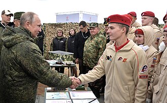 Vladimir Putin with members of the 'Yunarmiya' – or Young Army. The Young Army movement is the Kremlin's attempt to mobilize and provide basic military skills to Russian youth.