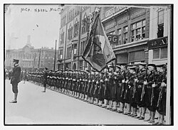 Sailors of the Michigan Naval Militia standing at attention during a parade in the 1920s, following World War I