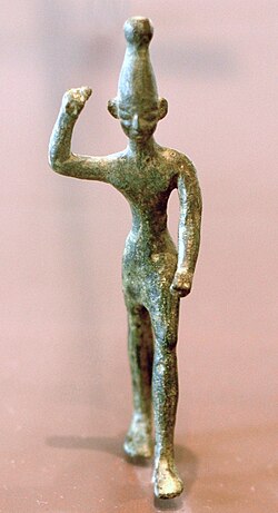 Figure of Ba'al with raised arm, 14th–12th century BC, found at ancient Ugarit (Ras Shamra site), a city at the far north of the Phoenician coast. Musée du Louvre.