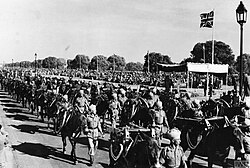 Indian Army soldiers pass the saluting base in the Delhi Victory Week Parade, 7 March 1946.[65]