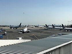 The skylines of New York City and Jersey City as seen from Newark Liberty International Airport in September 2022