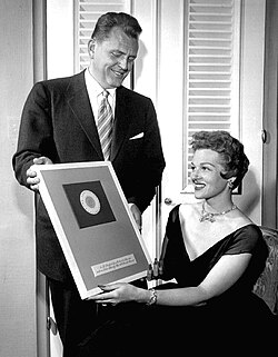 In 1954, James Conkling, president of Columbia Records, presented Stafford with a diamond-studded plaque to mark the sale of 25 million of her records.