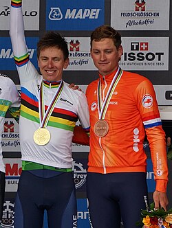 Pogačar (left) and Mathieu van der Poel (right) on the podium of the 2024 UCI World Championships road race