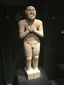 The "Worshipping Servant" statue (2500 BCE), above one metre (3 ft 3 in) in height, is much taller than any possible Mesopotamian or Harappan models. Photo courtesy of the National Museum of Korea.[60]