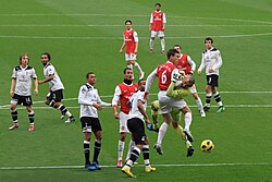 Arsenal playing against rivals Tottenham, in a game known as the North London derby, in November 2010