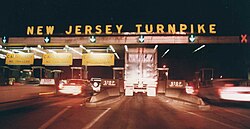 Approaching the exit 11 tollbooths at night in 1992, prior to the installation of E-ZPass