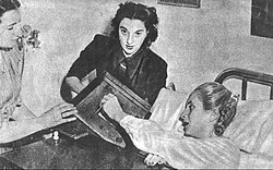 The ailing Eva Perón (right) casts a vote for the "reason of her life," President Juan Perón.