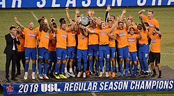 The players and staff celebrate clinching the 2018 USL regular season title.
