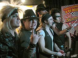 Moderatto known for their exaggerated on-stage personae that parody the stereotypical 1980s glam metal lifestyle.