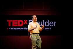 Polis during a TED Talk in 2010