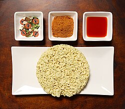 Contents of a Shin Ramyun package: Noodles, dried vegetables, spices, and oil