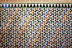 The elaborate and colourful zellige tessellations of glazed tiles at the Alhambra in Spain that attracted the attention of M. C. Escher