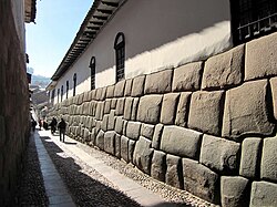 View of Hatun Rumiyuq Street. Many of the colonial constructions used the city's Inca constructions as a base.[31]