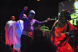The Aquabats fighting villains in San Francisco in 2012. Many of these onstage villains have been established in The Aquabats' fictional superhero mythology, with developed backstories of their own.