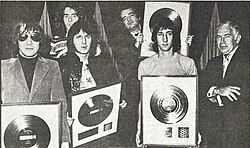 The Who and manager Kit Lambert with gold records for Tommy