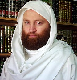 Syrian Dr. Khaldoun Al-Hassani Al-Jazairi in his home library.