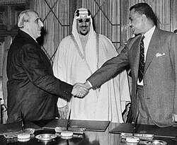 Quwatli (left) with President Gamal Abdel Nasser of Egypt (right) and King Saud of Saudi Arabia (center) concluding a defense agreement between the three countries, 1956