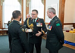 Officers in No. 1 Dress, the Army's ceremonial service dress, with a remembrance poppy on their lapels