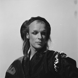 Bill Martin named the early solo work of Brian Eno (pictured in 1974) as the foremost catalyst in progressive rock's transition to post-progressive.