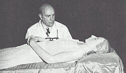 Pedro Ara inspecting Eva Perón's embalmed corpse
