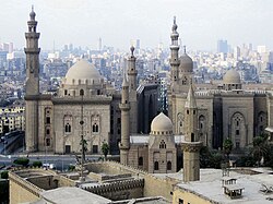 Mosque-Madrassa of Sultan Hassan (left) along with the later Al-Rifa'i Mosque (right) and two Ottoman mosques (foreground) in Cairo