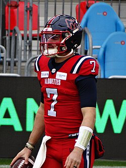 Cody Fajardo wearing the Montreal Alouettes' red third jersey in 2023.